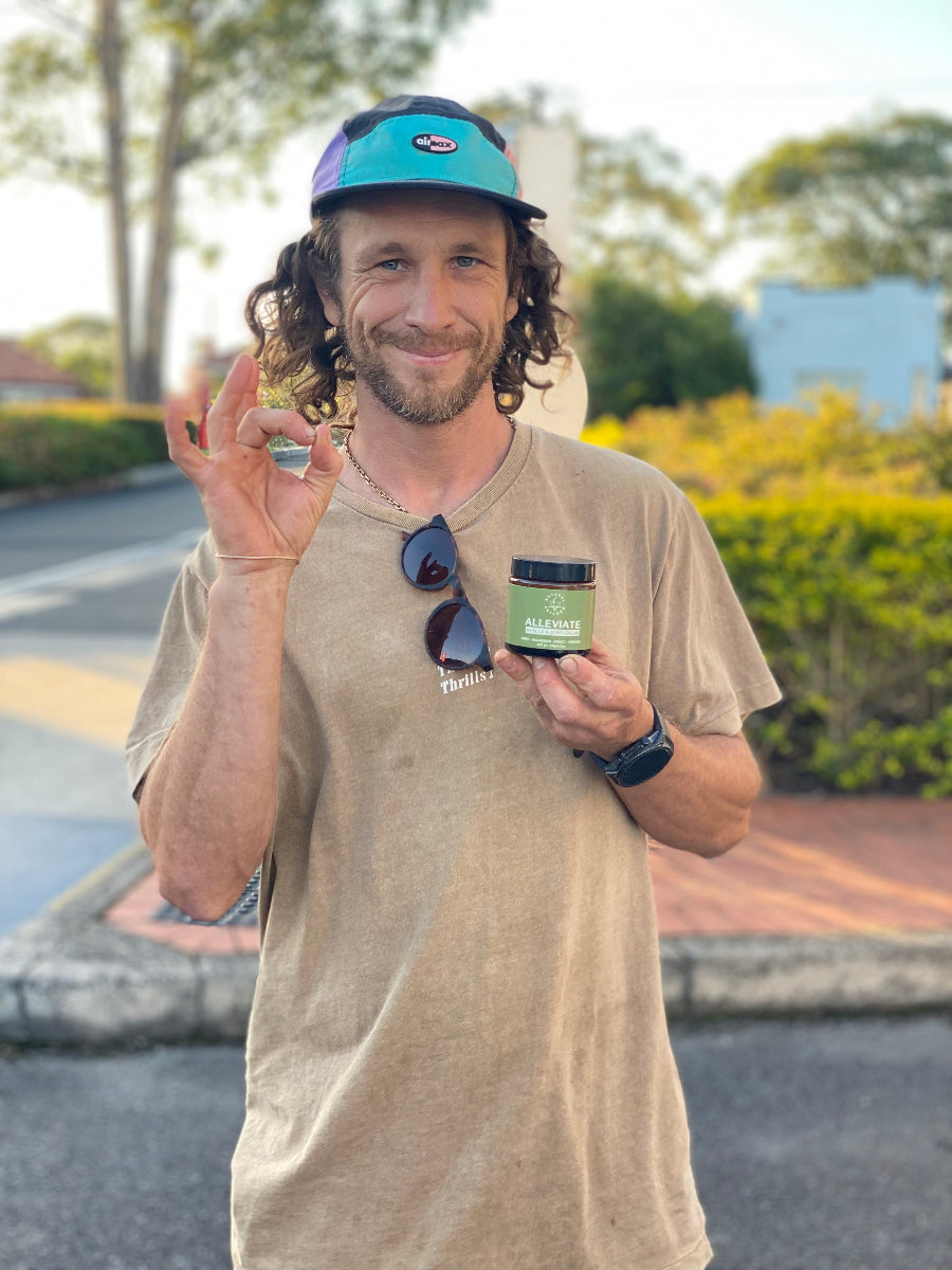 natural artform sponsored athlete ultra runner ezra dingo using ALLEVIATE balm