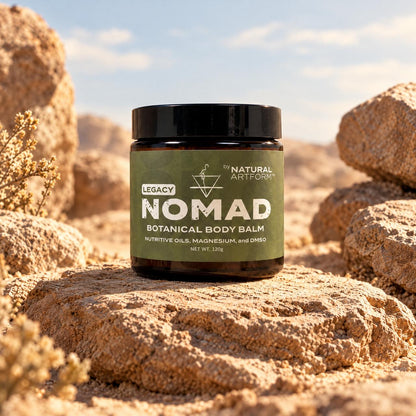NOMAD Legacy Botanical Body Balm on desert rocks