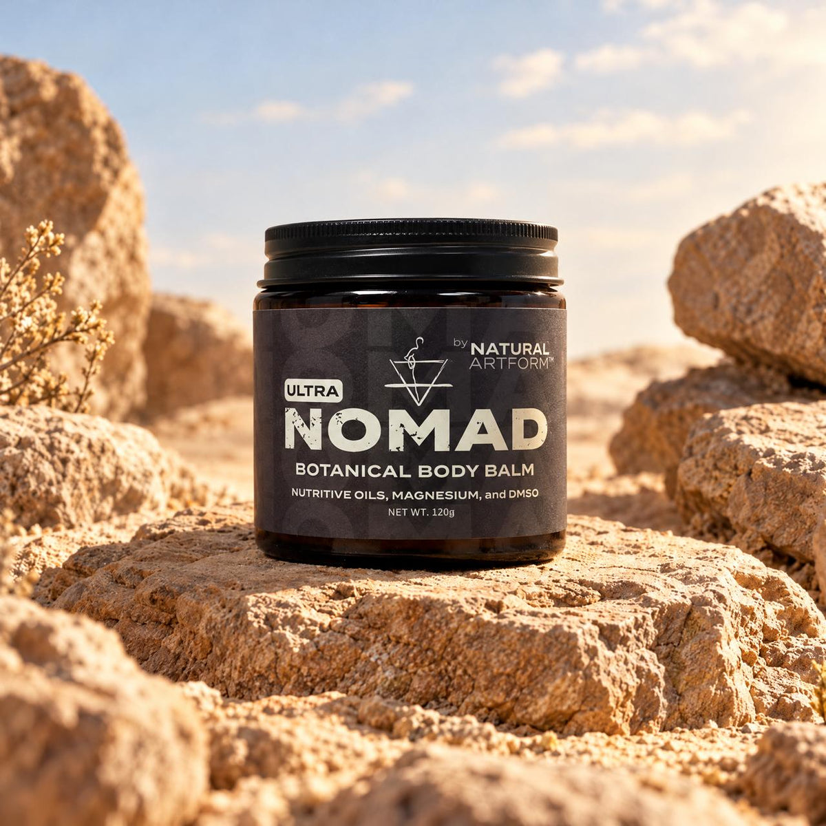 NOMAD Ultra Botanical Body Balm on desert rocks
